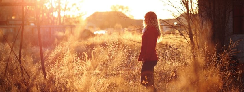 woman in sunset field