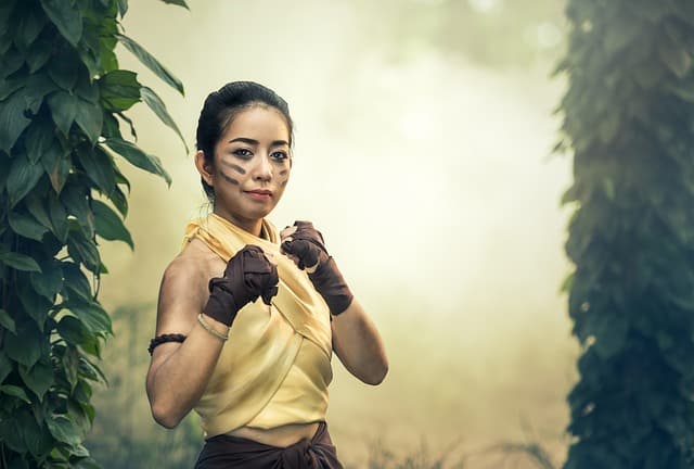 VICTORIOUS WOMAN IN JUNGLE