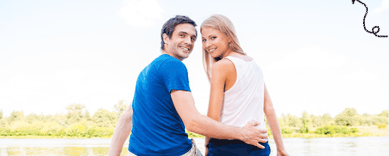 happy couple on river