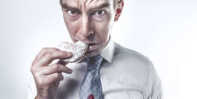 man eating biscuit