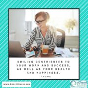 woman smiling at desk