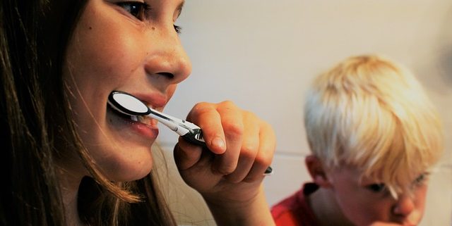 girl brushing teeth