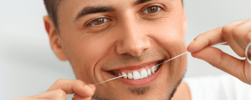 flossing to avoid white spots on teeth