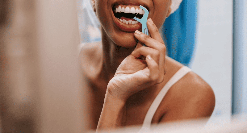 a woman flossing 